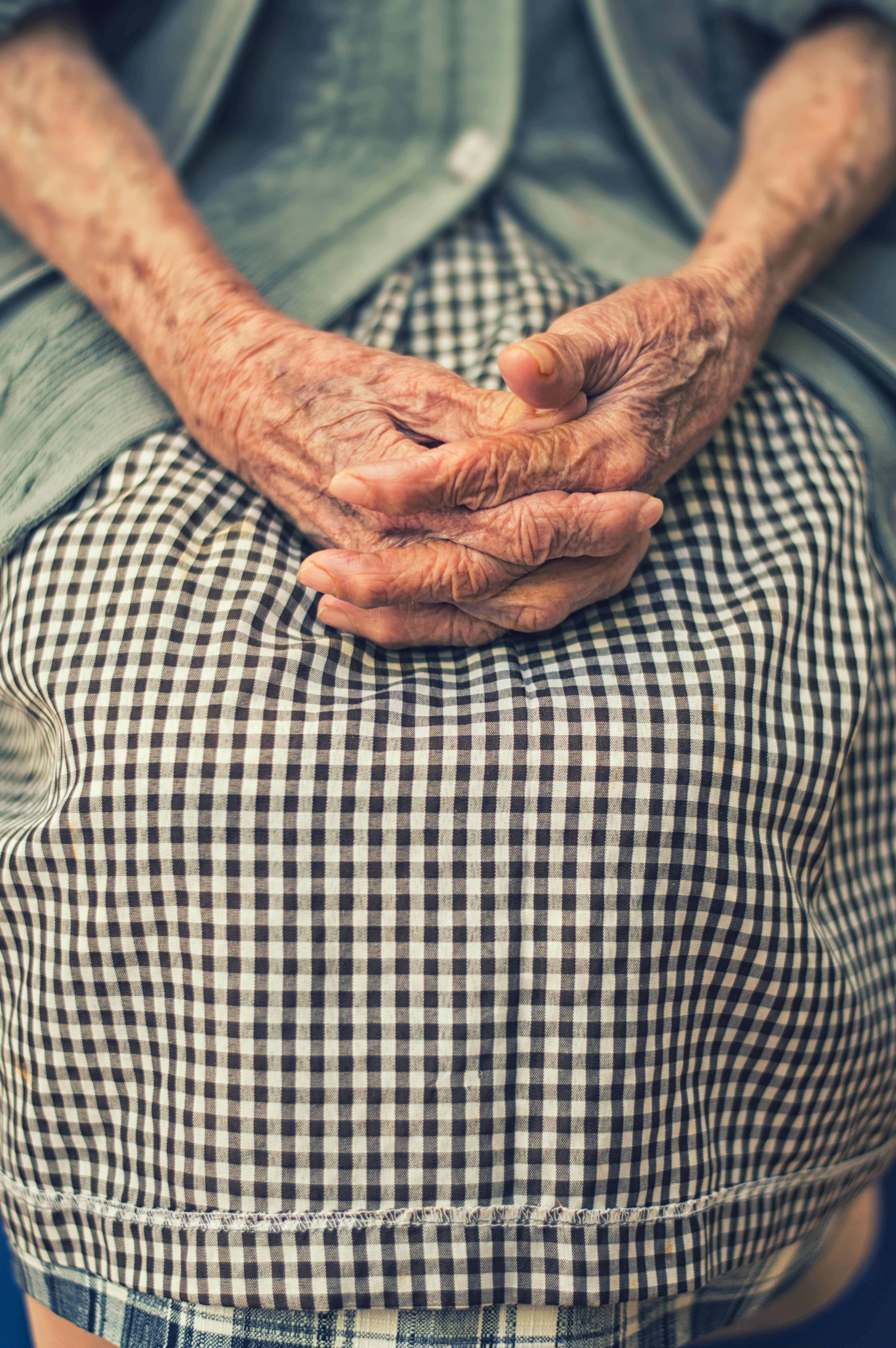 elderly woman crossing hands