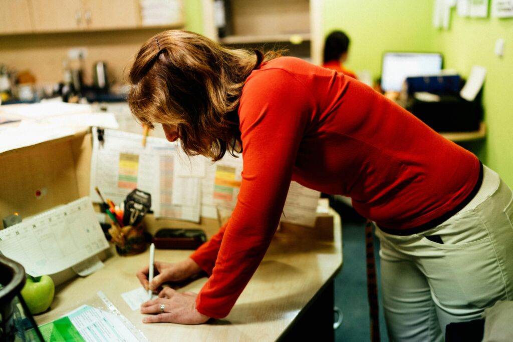 Nursing Home Receptionist Takes Notes